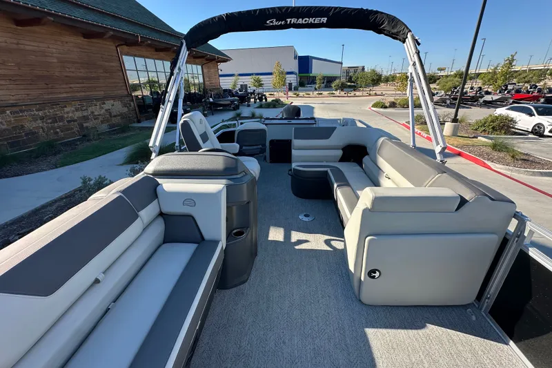 Slide: The Image of 2026 Sun Tracker Fishin' Barge 22 DLX pontoon boat with spacious seating and modern design. - 17