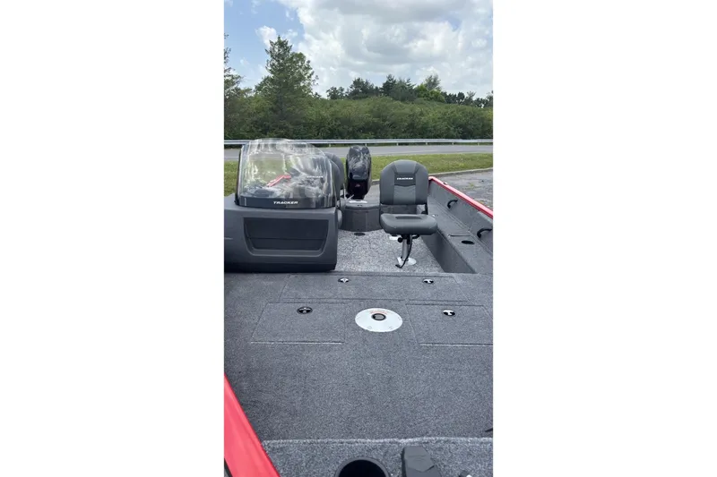 Slide: The Image of 2026 Tracker Pro Guide V-16 SC boat interior with seating and console. - 3