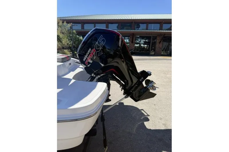 Slide: The Image of 2026 Tahoe T18 boat with Mercury Pro XS outboard motor in sunlight. - 4
