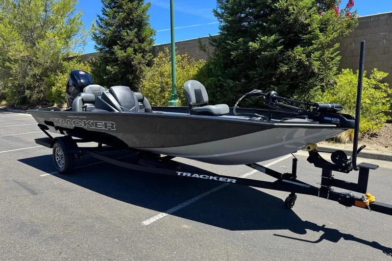 Slide: The Image of 2026 Tracker Pro Team 190 boat on trailer in sunny parking lot. - 6