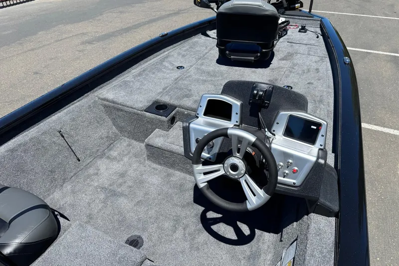 Slide: The Image of 2026 Tracker Pro Team 190 boat interior with steering wheel and control panel. - 12