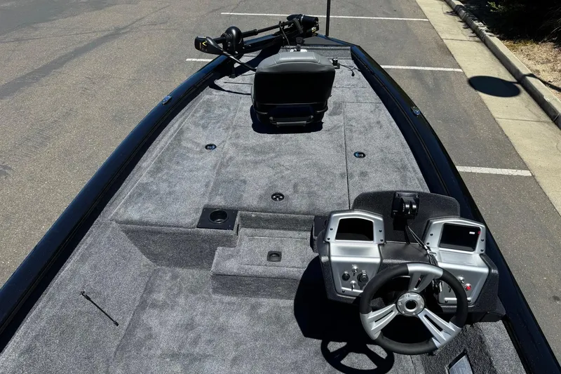 Slide: The Image of 2026 Tracker Pro Team 190 boat interior with steering console and seating. - 8