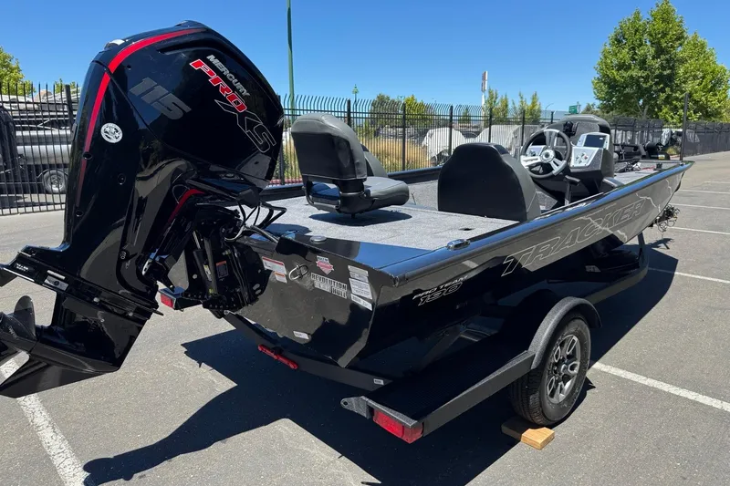 Slide: The Image of 2026 Tracker Pro Team 190 boat with Mercury Pro XS engine, parked outdoors. - 7