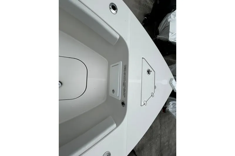 Slide: The Image of 2025 Ranger 2600 Bay boat deck, featuring storage compartments and sleek design. - 5