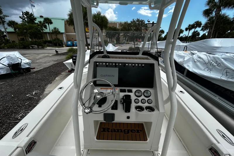 Slide: The Image of 2025 Ranger 2600 Bay boat console with Garmin navigation system and steering wheel. - 9