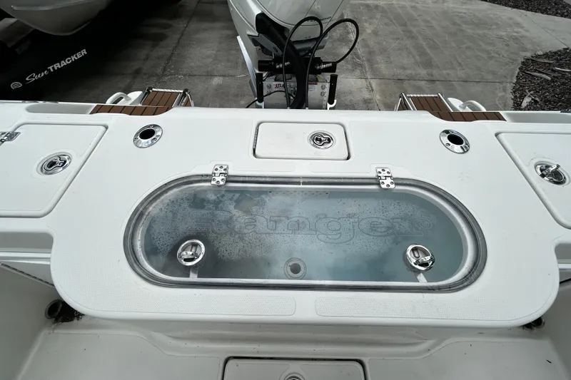 Slide: The Image of 2025 Ranger 2600 Bay boat deck with livewell and fishing equipment. - 12