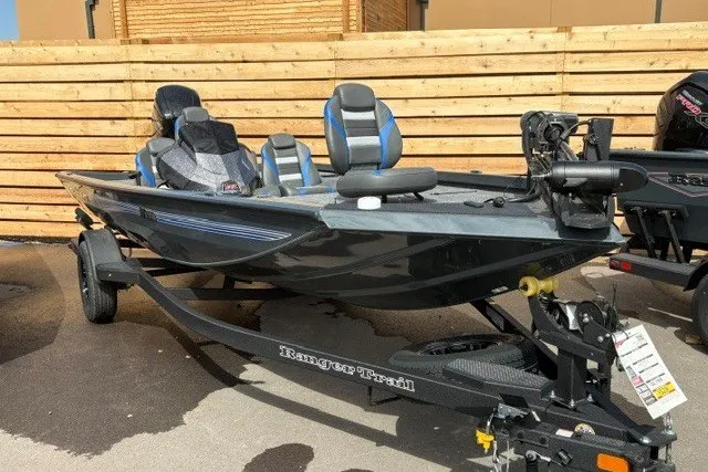 The Image of 2026 Ranger RT178 boat with blue seats on a trailer, parked outdoors. - 0