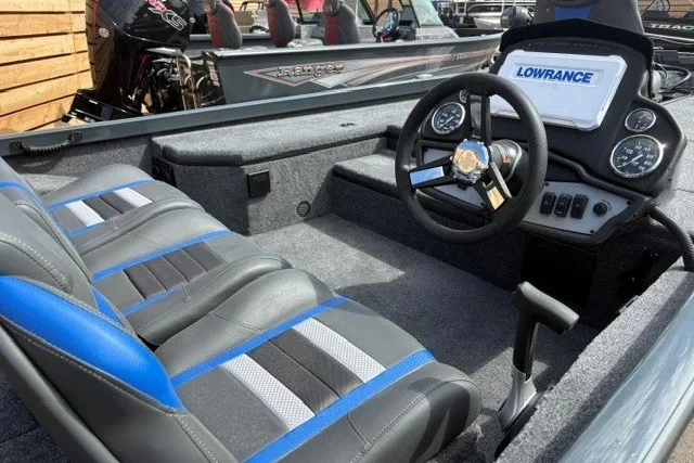 Slide: The Image of 2026 Ranger RT178 boat interior with Lowrance electronics and stylish seating. - 4