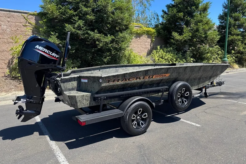 Slide: The Image of 2026 Tracker Grizzly 1756 T Marsh boat with Mercury engine on trailer. - 2