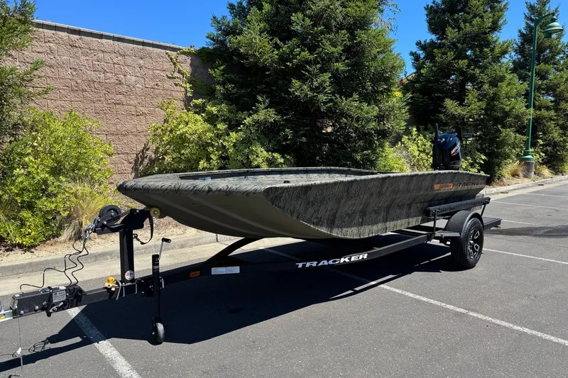 Slide: The Image of 2026 Tracker Grizzly 1756 T Marsh boat on trailer in parking lot. - 5
