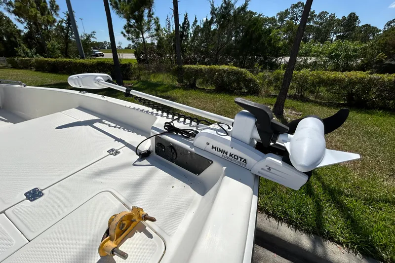 Slide: The Image of 2024 Mako Pro Skiff 17 CC with Minn Kota trolling motor on deck. - 10