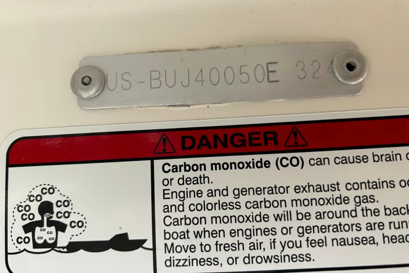 Slide: The Image of 2024 Mako Pro Skiff 17 CC warning label about carbon monoxide dangers. - 11