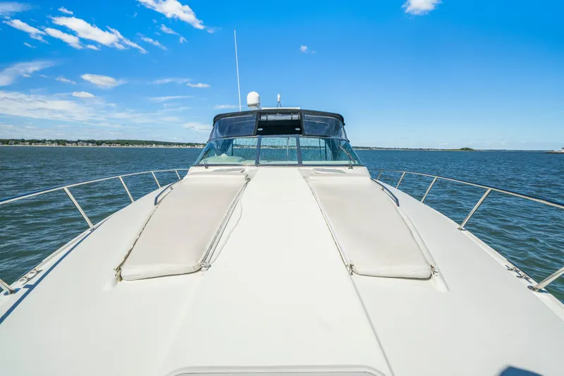 Slide: The Image of 2000 Formula 41 Performance Cruiser on open water under clear blue sky. - 10