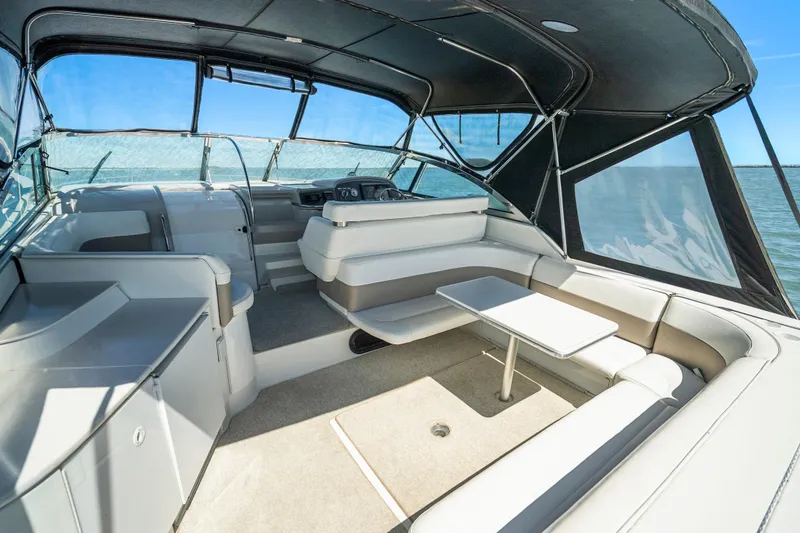 Slide: The Image of Interior of 2000 Formula 41 Performance Cruiser with seating and table, under canopy. - 12