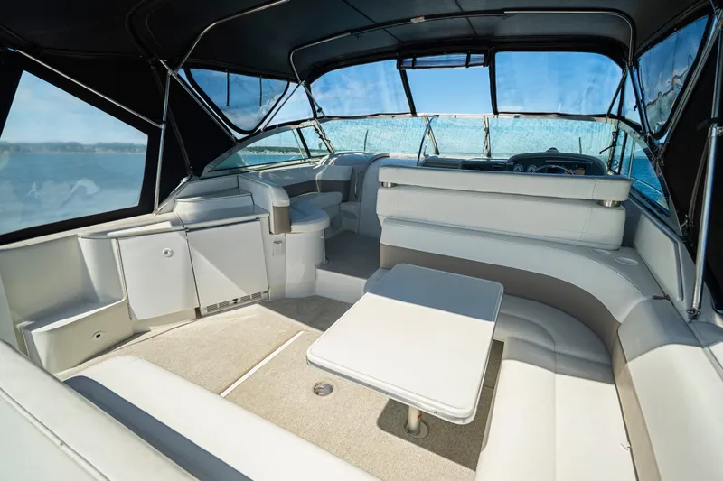 Slide: The Image of Interior of a 2000 Formula 41 Performance Cruiser with seating and table. - 13