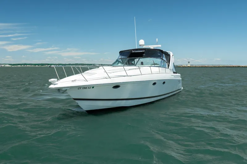 Slide: The Image of 2000 Formula 41 Performance Cruiser on open water under clear blue sky. - 2