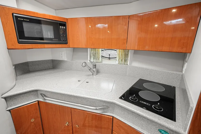 Slide: The Image of Modern kitchen in 2000 Formula 41 Performance Cruiser with microwave and stovetop. - 23