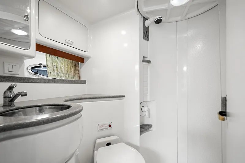 Slide: The Image of Modern bathroom in a 2000 Formula 41 Performance Cruiser yacht, featuring sleek fixtures and compact design. - 29