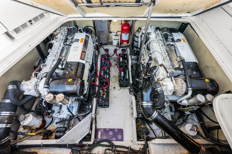Slide: The Image of Engine room of a 2000 Formula 41 Performance Cruiser with dual engines and fire extinguisher. - 30