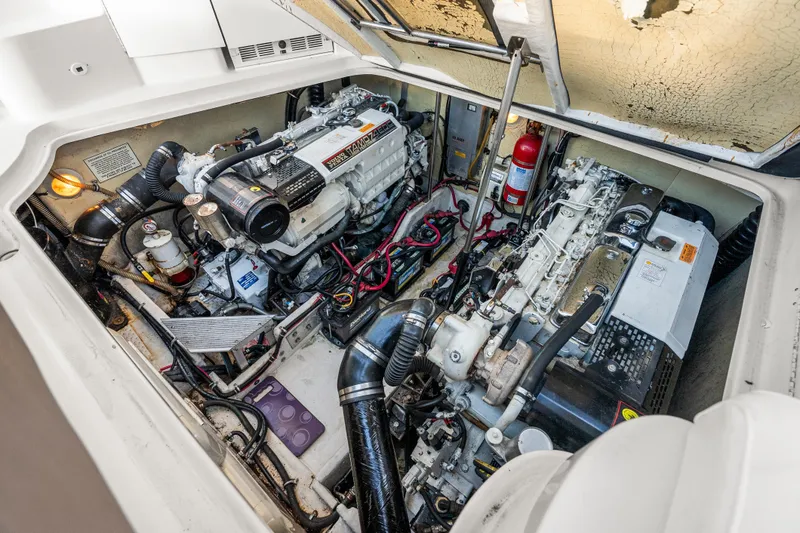Slide: The Image of Engine compartment of a 2000 Formula 41 Performance Cruiser, showcasing dual engines and components. - 31