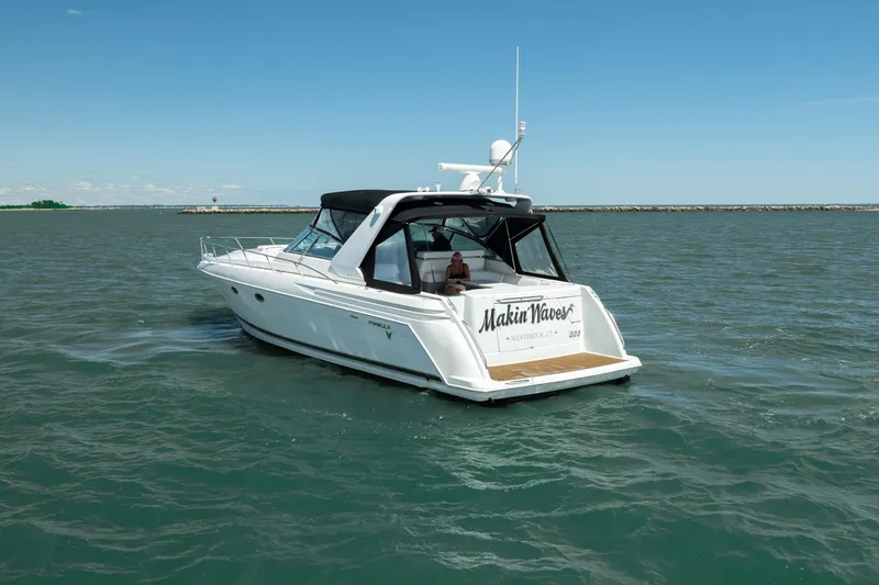 Slide: The Image of 2000 Formula 41 Performance Cruiser on open water, featuring sleek design and "Makin Waves" branding. - 5