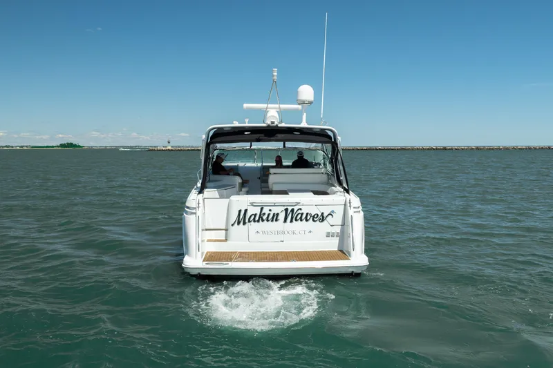 Slide: The Image of Formula 41 Performance Cruiser 2000 on open water, rear view, clear sky. - 6