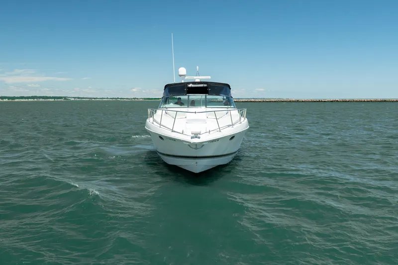 Slide: The Image of Front view of a 2000 Formula 41 Performance Cruiser on open water. - 8