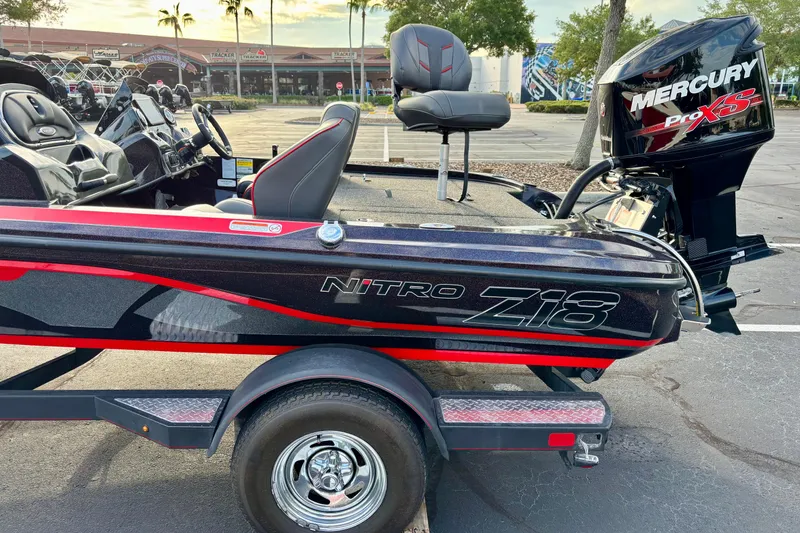 The Image of 2018 Nitro Z18 boat with Mercury Pro XS engine in parking lot. - 0