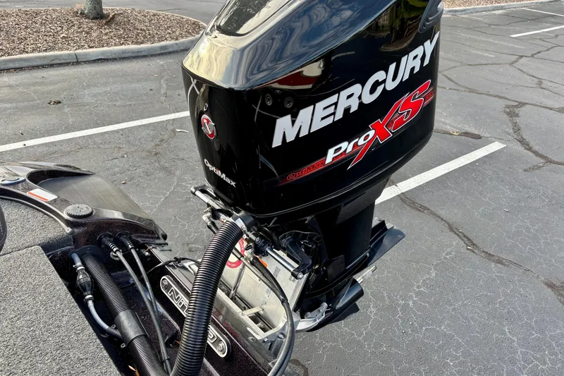 Slide: The Image of 2018 Nitro Z18 boat with Mercury Pro XS outboard motor in parking lot. - 2