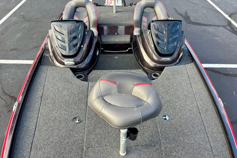 Slide: The Image of 2018 Nitro Z18 boat interior with dual seats and central fishing chair. - 4