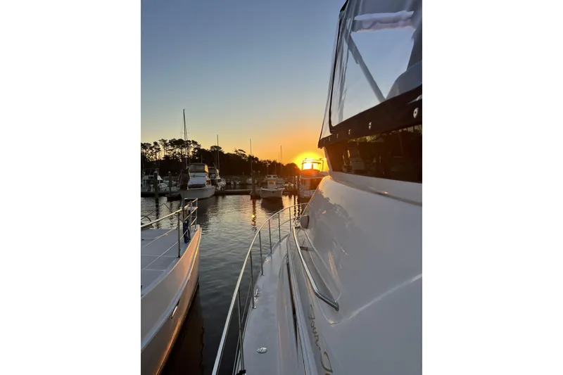 Slide: The Image of 1999 Sea Ray 420 Aft Cabin yacht at sunset in marina. - 8