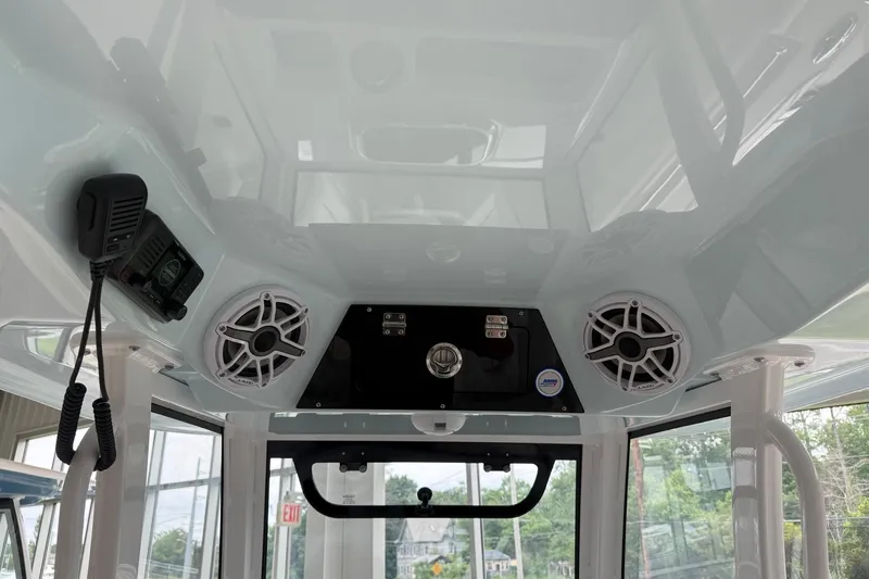 Slide: The Image of 2026 Sportsman Open 282 Center Console interior with speakers and communication equipment. - 12