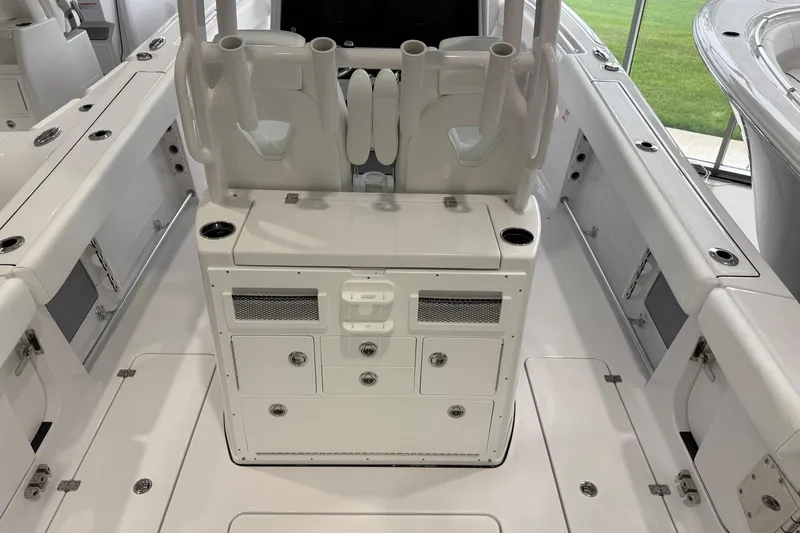 Slide: The Image of 2026 Sportsman Open 282 Center Console boat interior with seating and storage compartments. - 13