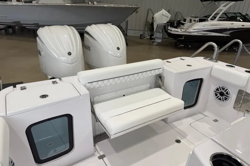 Slide: The Image of 2026 Sportsman Open 282 Center Console boat interior with dual Yamaha engines. - 15