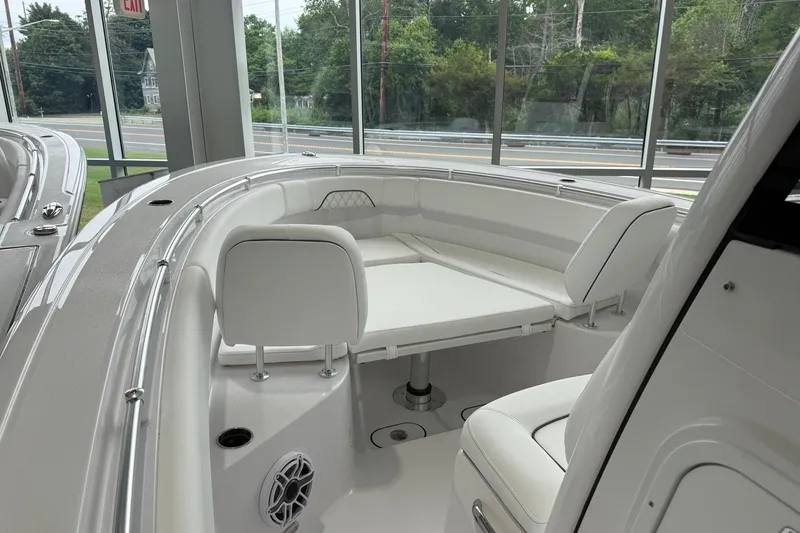 Slide: The Image of 2026 Sportsman Open 282 Center Console boat interior with white seating and modern design. - 2