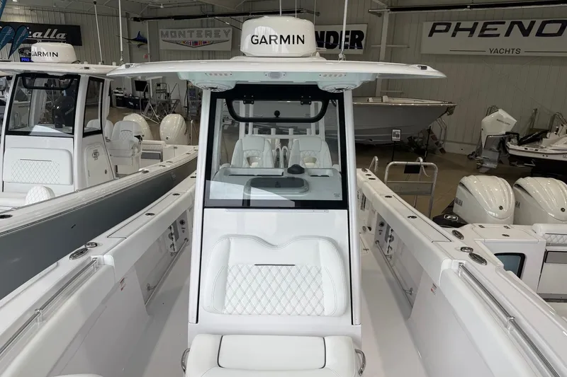Slide: The Image of 2026 Sportsman Open 282 Center Console boat with Garmin electronics in showroom. - 6