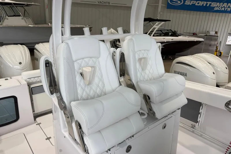Slide: The Image of 2026 Sportsman Open 282 Center Console with luxurious white seating in showroom. - 9