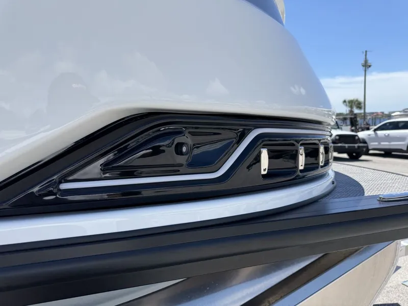 Slide: The Image of Close-up of a boat's sleek design with shiny black and silver accents. - 18