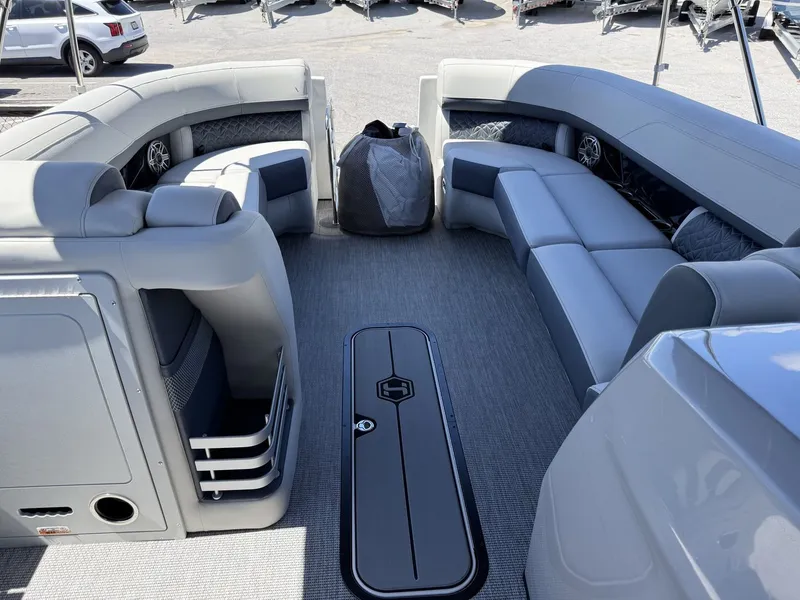 Slide: The Image of The image shows the spacious deck of a 2027 Harris Grand Mariner 250 with gray upholstery. - 30