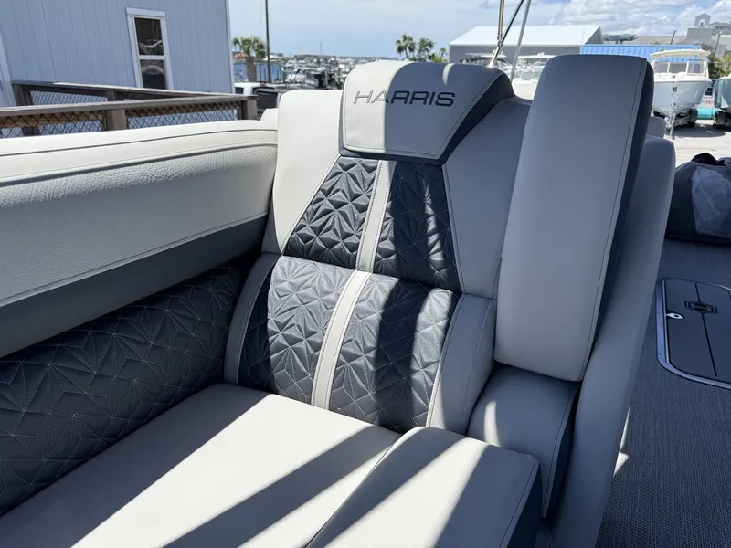 Slide: The Image of Luxurious seating area with quilted pattern and Harris logo on a modern boat. - 42