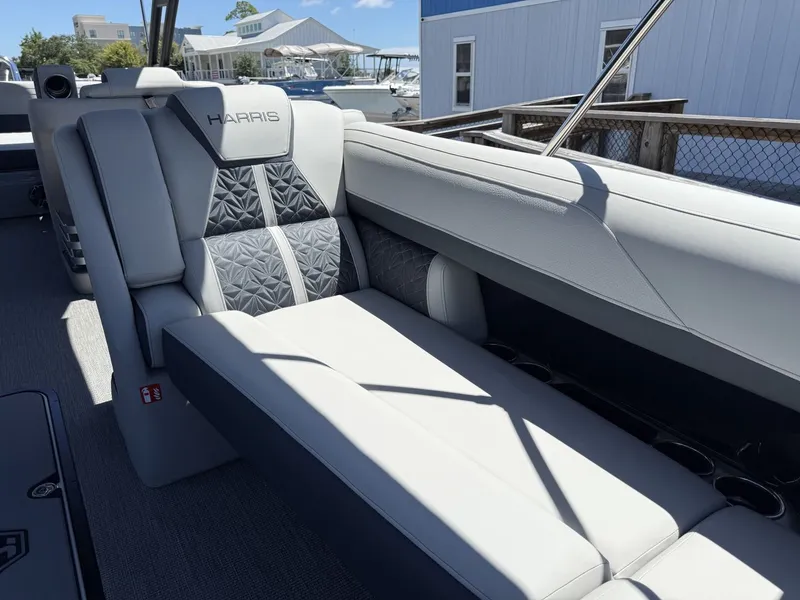 Slide: The Image of Luxurious lounging area on a Harris Grand Mariner 250 pontoon boat, featuring sleek gray upholstery. - 21