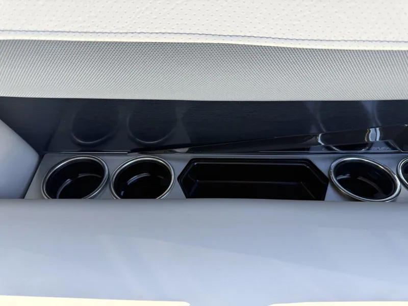 Slide: The Image of The 2027 Harris Grand Mariner 250 features stylish cup holders integrated into the seat back. - 22