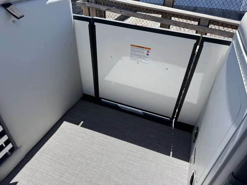 Slide: The Image of Interior of a 2027 Harris Grand Mariner 250 with modern design and gray flooring. - 28