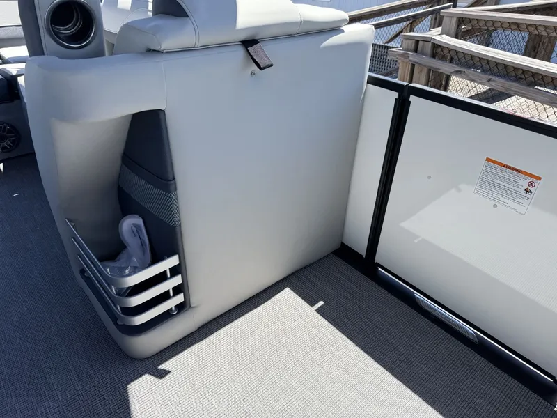 Slide: The Image of The image shows part of the interior of a 2027 Harris Grand Mariner 250 with gray upholstery. - 27