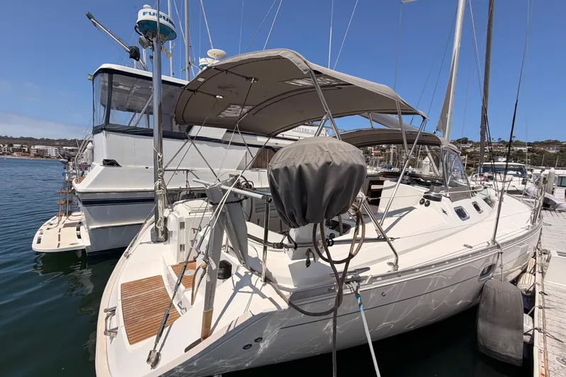 Slide: The Image of Jeanneau Sun Odyssey 45.2 sailboat docked at marina, 1999 model, sunny day. - 10