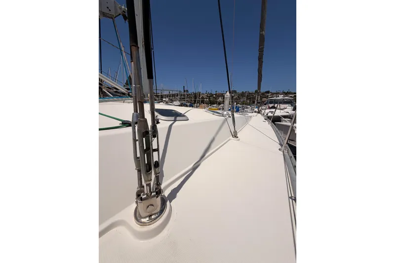 Slide: The Image of Deck view of 1999 Jeanneau Sun Odyssey 45.2 sailboat in marina. - 13