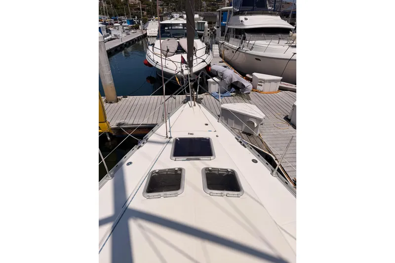 Slide: The Image of Jeanneau Sun Odyssey 45.2 sailboat docked at marina, 1999 model. - 14