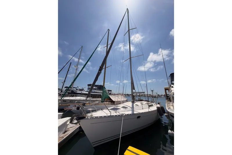 Slide: The Image of Sailboat Jeanneau Sun Odyssey 45.2, 1999 model, docked under a sunny sky. - 2