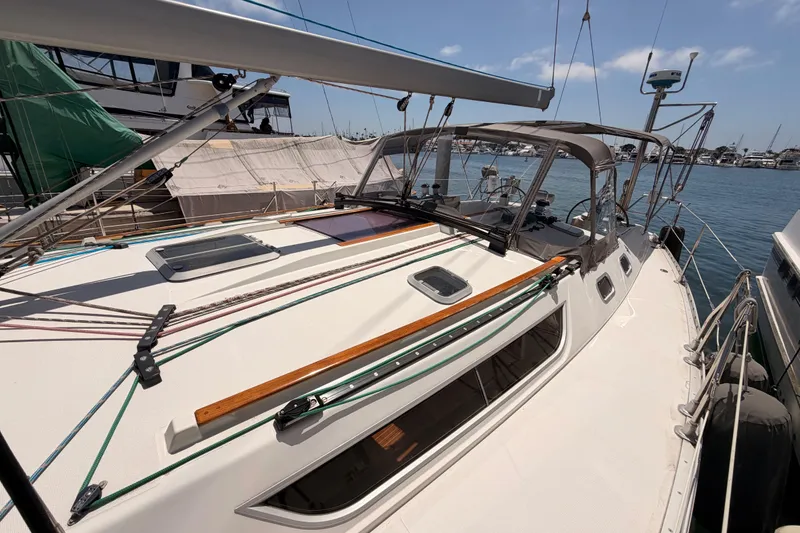 Slide: The Image of 1999 Jeanneau Sun Odyssey 45.2 sailboat docked at marina, showcasing deck and rigging. - 20