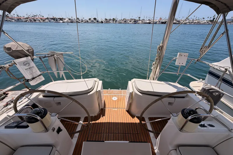 Slide: The Image of Cockpit view of 1999 Jeanneau Sun Odyssey 45.2 sailboat, overlooking marina. - 24